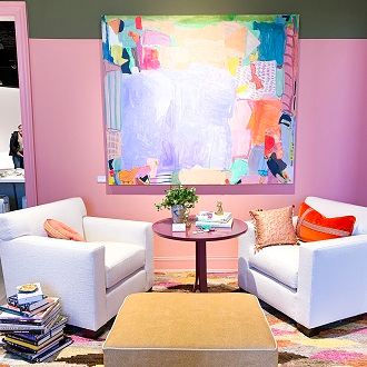 White chairs with pink wall and bold art & accents